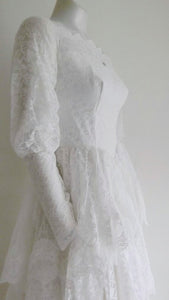 Vintage 50s five tiered lace wedding dress with small train and attached tulle net crinoline underskirt